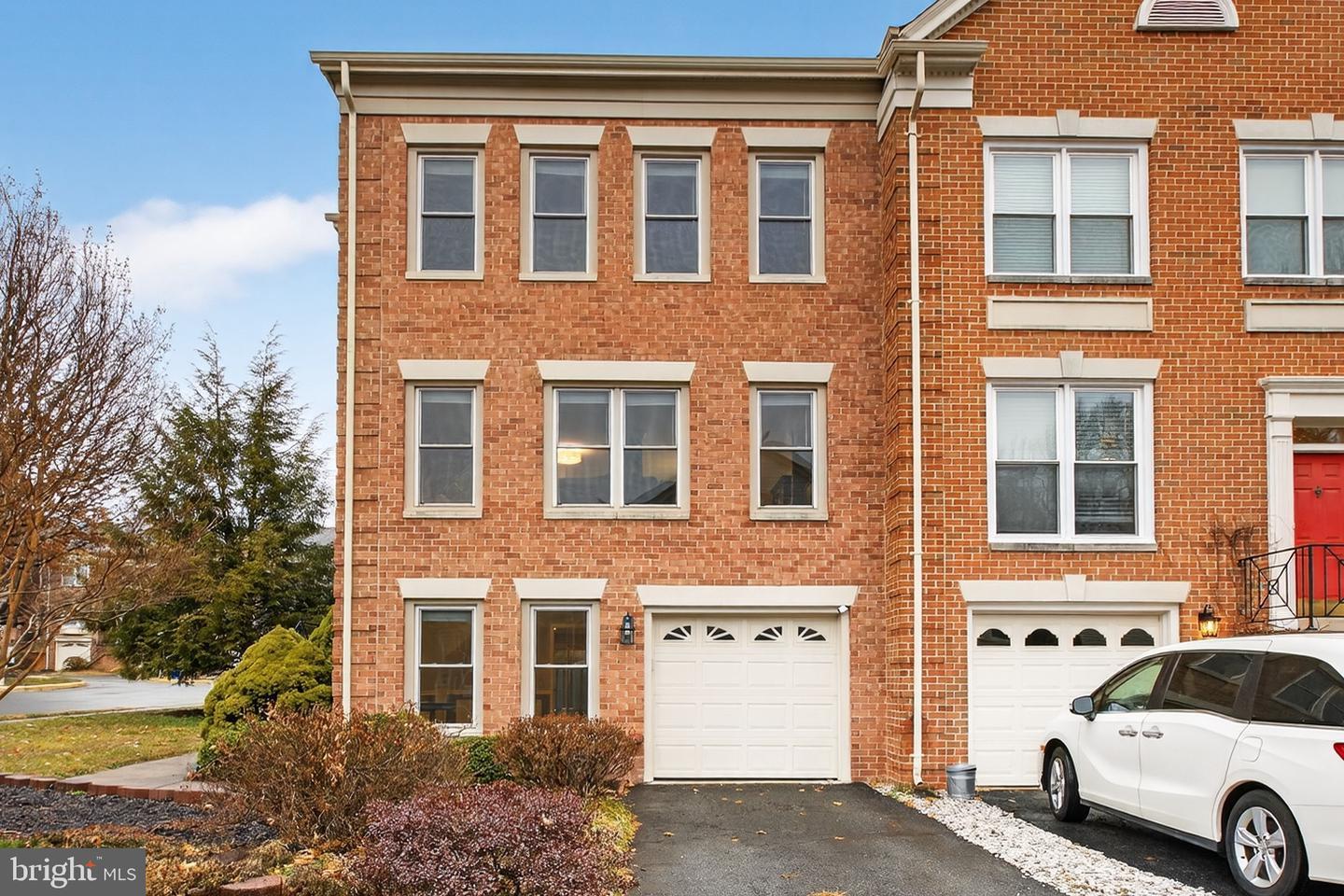 Sully Station Centreville VA townhouse with brick facade and one-car garage, sold by David Mount in 2026