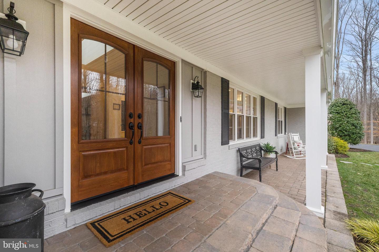 Front exterior with porch of the six-bedroom luxury home at 7510 Willowbrook Rd in Fairfax Station, Virginia, sold by David Mount in 2023 for $1.3 million